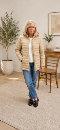 Woman wearing a beige puffer jacket 